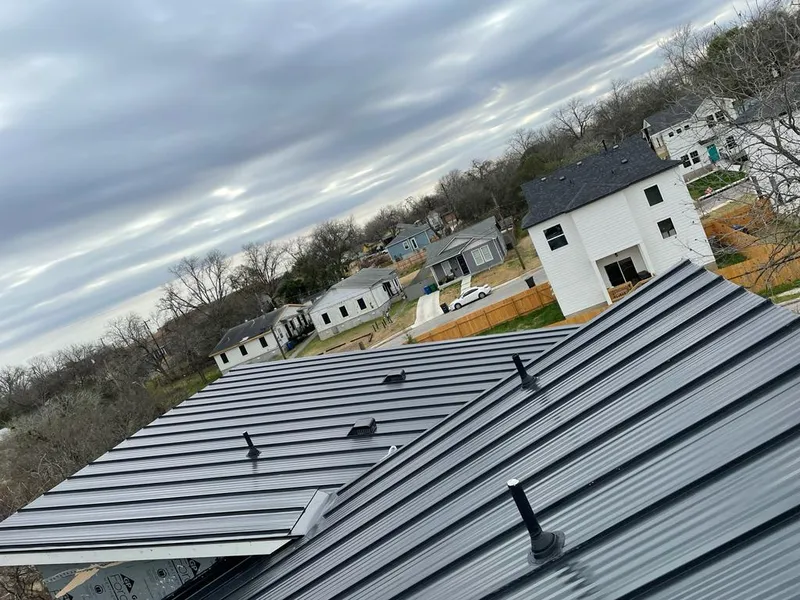 Standing seam metal roof panels with vents for Skylight Repair in Fairview Park